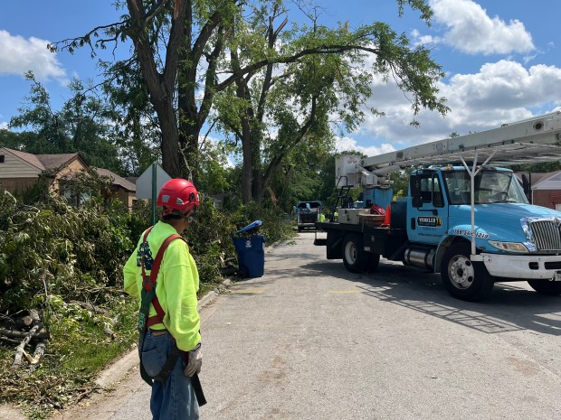 Humberto Cervantes, an employee with Winkler Tree and Lawn Care, helped to clear fallen trees in a Homewood neighborhood after the July storms. (Samantha Moilanen/Daily Southtown)