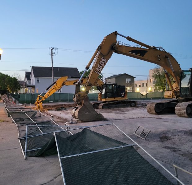 A fallen fence is all that remains after vacant buildings on Broadway Avenue in Harvey were demolished, which Harvey Historical Society's lead preservationist, Ryan Sinwelski, says have historical value. (Harvey Historical Society)