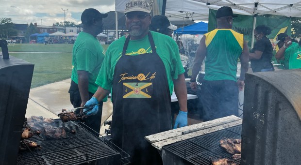 Aeon Fox, of Calumet City, cooks up jerk chicken for Jamaican4Life at the inaugural Cultural Celebration Day Saturday Aug. 17, 2024, in Lansing. (Jeff Vorva/for the Daily Southtown)