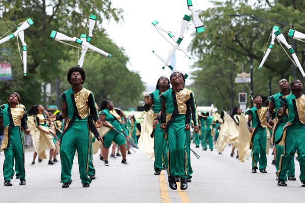 Members of the South Shore Drill Team perform in the Bud Billiken Parade on South King Drive on Aug. 13, 2022, in Chicago. (John J. Kim/Chicago Tribune)