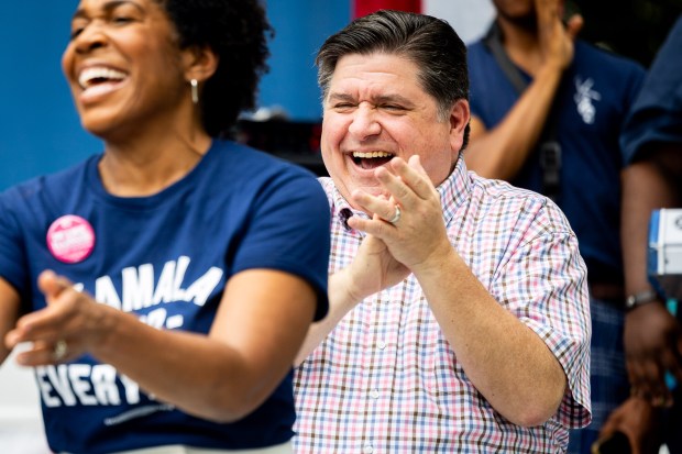 Gov. JB Pritzker smiles at Lt. Gov. Juliana Stratton during Governor's Day at the Illinois State Fair in Springfield on Aug. 14, 2024. (Tess Crowley/Chicago Tribune)