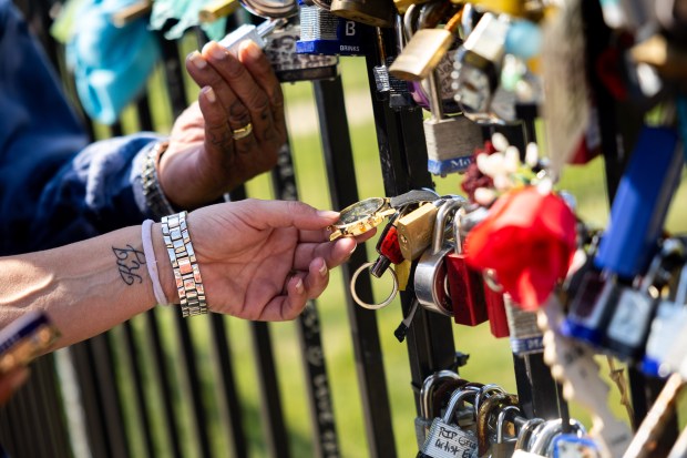 Dee Hill and wife Bree Hill, from Arizona, celebrate Michael Jackson's birthday by spending time outside the Jackson Family Home in Gary, Indiana on Aug. 29, 2024. (Tess Crowley/Chicago Tribune)