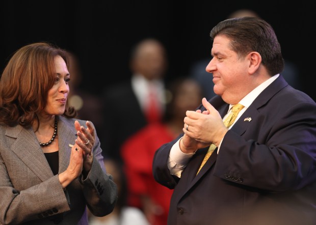 Vice President Kamala Harris talks with Gov. J.B. Pritzker after they gave speeches ahead of midterm elections in Chicago on Nov. 6, 2022. (Michael Blackshire/Chicago Tribune)