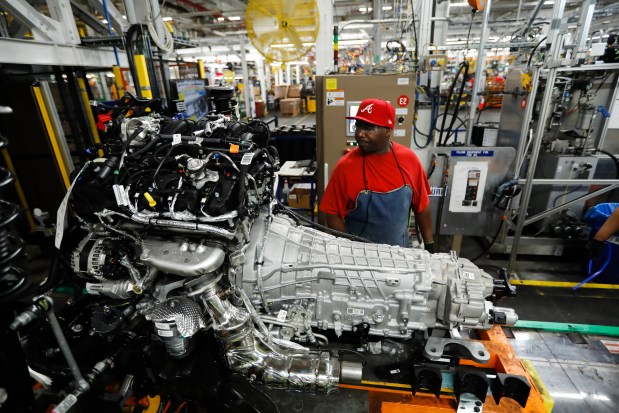 Workers on the assembly line at the Ford Chicago Assembly Plant where the Ford Explorer and Lincoln Aviator sport utility vehicles are worked on, June 24, 2019. Ford invested $1 billion in its Chicago-area manufacturing operations to expand production of its all-new Ford Explorer and Lincoln Aviator sport utility vehicles. (José M. Osorio/Chicago Tribune)