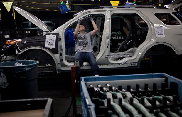 Workers on the assembly line for the new 2011 Ford Explorer at the Chicago Assembly Plant on Dec. 1, 2010. (Zbigniew Bzdak/ Chicago Tribune)