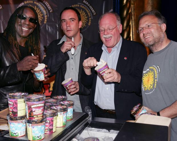 Dave Matthews, second from left, tastes the new "Dave Matthews Band Magic Brownies" flavor from Ben & Jerry's ice cream on May 17, 2005. With Matthews is band member Boyd Tinsley, left, and brand co-founders Ben Cohen, second from right, and Jerry Greenfield, at a news conference in New York. The Dave Matthews Band and Ben and Jerry's formed a coalition to fight global warming. (Don Emmert/AP)