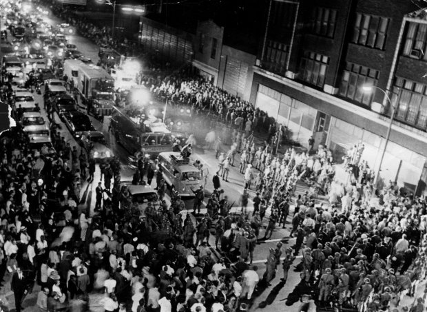 Demonstrators meet National Guardsmen and Chicago Police at Michigan Avenue and 18th street in August 1968. The anti-war march on the DNC was halted. (Chicago Tribune historical photo)