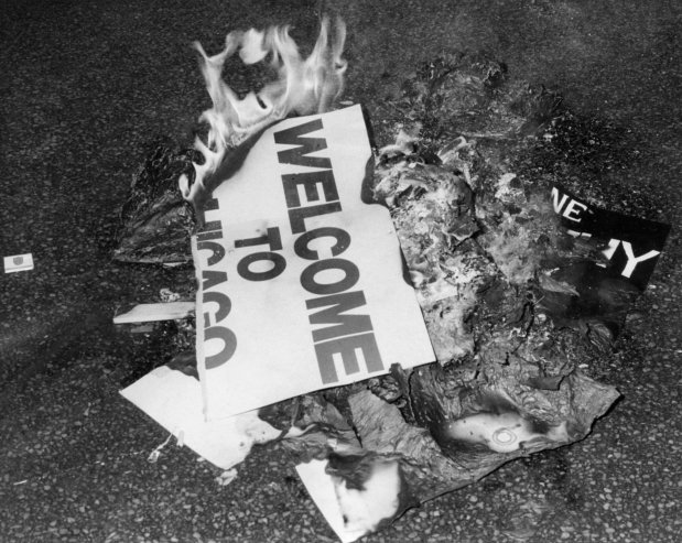 A "Welcome to Chicago" sign is burned during the Democratic National Convention in 1968. (Chicago Tribune historical photo)