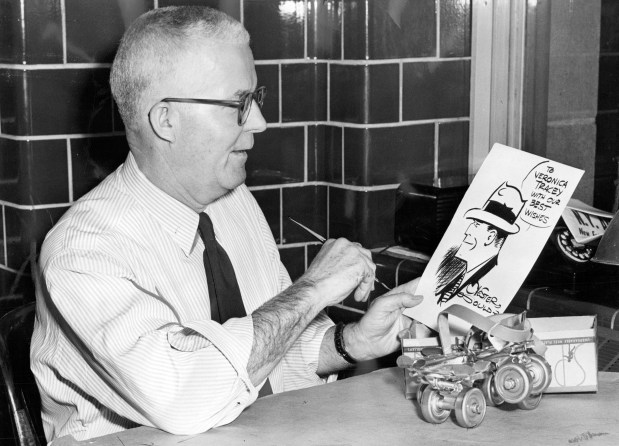 Chester Gould, whose cartoon Dick Tracy is familiar to millions, with a drawing and roller skates on Feb. 13, 1952 he planned to send to Veronica Tracey, 12. (Louis Paus/Chicago Tribune)