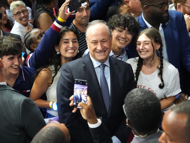 Doug Emhoff, Vice President Kamala Harris' husband, takes a photo with supporters during a campaign event with Harris, the Democratic presidential candidate, and her vice presidential running mate, Minnesota Gov. Tim Walz, on Aug. 6, 2024, in Philadelphia. (Andrew Harnik/Getty)