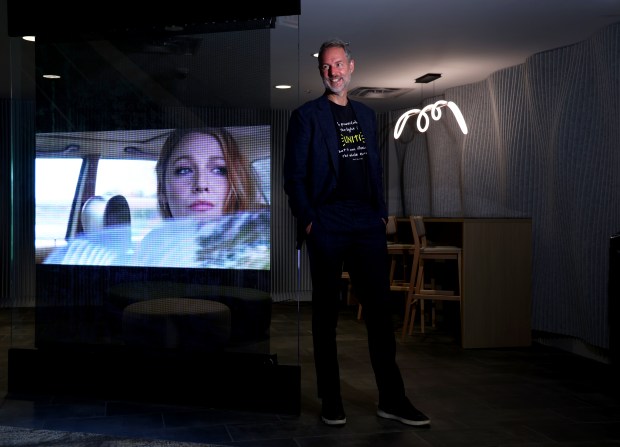 Wayfarer Studios co-founder Steve Sarowitz with a hologram of Blake Lively inside of his renovated movie theater in downtown Highland Park on Aug. 13, 2024. Sarowicz is the producer of the new movie starring Lively "It Ends with Us." (Stacey Wescott/Chicago Tribune)