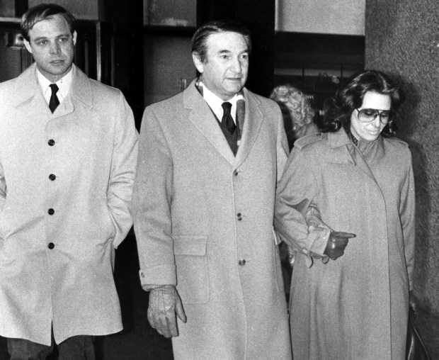 Former Cook County Commissioner Martin Tuchow, center, walks with unidentified people in the Dirksen federal building on Dec. 7, 1983 after he was found guilty of charges of extortion for soliciting payments from contractors in exchange for city building permits. (Karen Engstrom/Chicago Tribune)