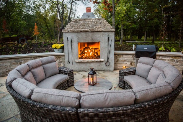 A terrace with a fireplace is among the outdoor spaces at The Cottage at Bunker Hill Farms. (Bunker Hill Farms)