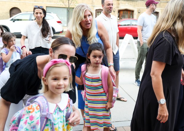 Suzanne Mak speaks to her daughter kindergartner Addie Mak on her first day of school at Hamilton Elementary School in Lake View Monday, Aug. 26, 2024. (Eileen T. Meslar/Chicago Tribune)