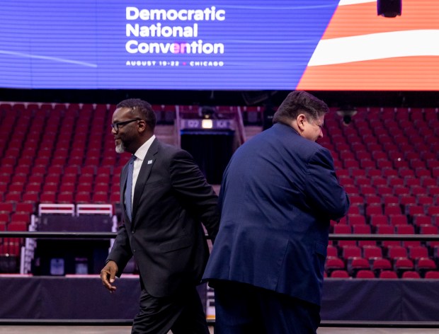 Mayor Brandon Johnson and Gov. J.B. Pritzker take turns speaking during a walkthrough of the Democratic National Convention on Wednesday, May 22, 2024, at the United Center. (Brian Cassella/Chicago Tribune)