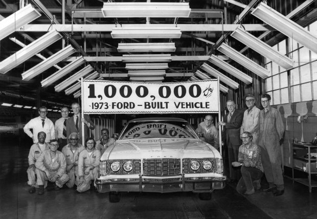 The one millionth 1973 vehicle rolled off the Ford Motor Company's Chicago assembly plant at Torrence Avenue on Nov. 20, 1972, at 11:04 a.m. Holding the sign over the Ford LTD Brougham are F. Emmett Evans, Great Lakes region dealer affairs manager, and Thomas C. Brand, assembly plant manager, right. The company expects 1973 to be an all-time record year for auto production. (Chicago Tribune historical photo)