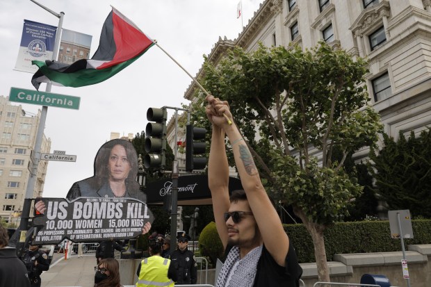 A protest group marches up Powell Street as Vice President Kamala Harris spoke to the Kamala Harris Victory Fund at the Fairmont Hotel in San Francisco on Aug. 11, 2024. (Carlos Avila Gonzalez/San Francisco Chronicle)