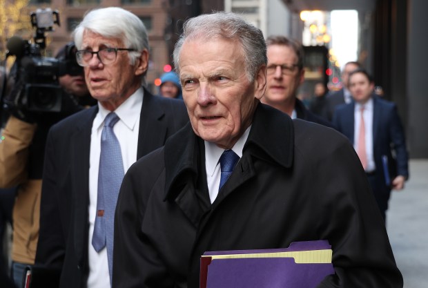 Former House Speaker Michael Madigan, center, leaves the Dirksen U.S. Courthouse in Chicago on Jan. 3, 2024. (Terrence Antonio James/Chicago Tribune)