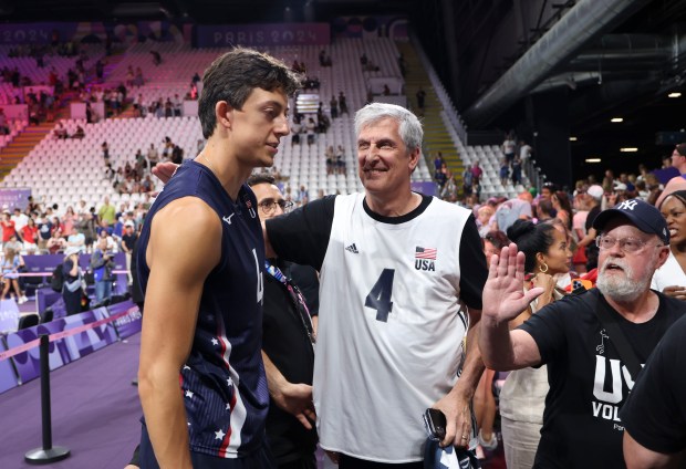 USA's Jeff Jendryk greets his dad, Jeff Jendryk Sr.,, after a men's volleyball qualifying match against Germany on July 30, 2024, at South Paris Arena during the Paris Olympics. (Brian Cassella/Chicago Tribune)