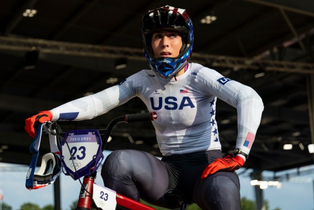 USA's Felicia Stancil talks to her coach while warming up to compete in a cycling BMX quarterfinal race on Aug. 1, 2024, at Saint-Quentin-en-Yvelines BMX Stadium during the Paris Olympics. (Brian Cassella/Chicago Tribune)