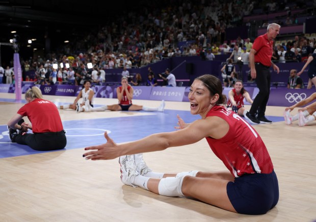 USA's Lauren Carlini (7) stretches with her teammates after a 3-0 women's volleyball quarterfinal win over Poland on Aug. 6, 2024, during the Paris Olympics. (Brian Cassella/Chicago Tribune)