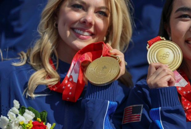 Alexa Knierim and her USA figure skating teammates finally receive their gold medals from the 2022 Beijing Winter Olympics on Aug. 7, 2024, at Champions Park in the Trocadero during the Paris Olympics. (Brian Cassella/Chicago Tribune)