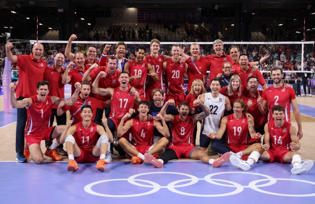 The USA men's volleyball team celebrates their bronze medal win with a 3-0 win over Italy on Aug. 9, 2024, at South Paris Arena 1 during the Paris Olympics. (Brian Cassella/Chicago Tribune)