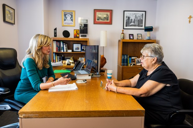 Rae Kaplan, owner and head attorney at Kaplan Law Firm, left, talks with client Pam Alexander, 72, of Woodridge during a consultation in her office in Chicago on July 24, 2024. Kaplan Law Firm helps individuals and families navigate student loans and bankruptcy. (Tess Crowley/Chicago Tribune)