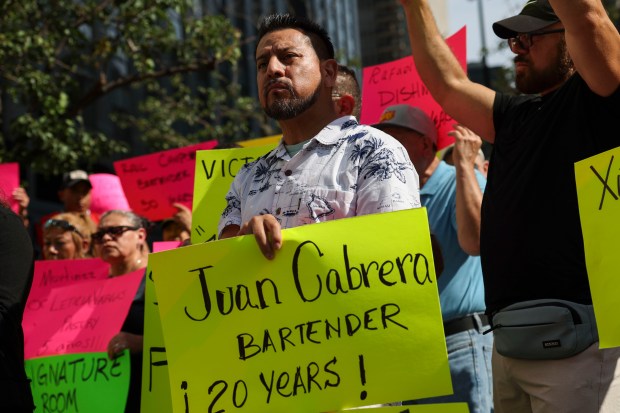 Former Signature Room workers protest outside of the 875 North Michigan Avenue building on Oct. 4, 2023. (Eileen T. Meslar/Chicago Tribune)