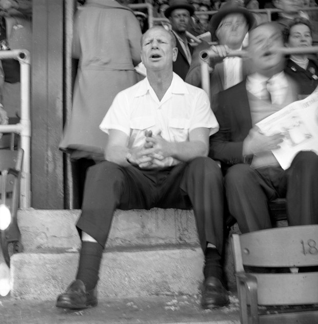 White Sox owner Bill Veeck sits on a step during a World Series game at Comiskey Park in October 1959. (Chicago Tribune historical photo)