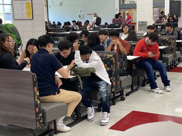 Students gather in the new cafeteria at North Chicago Community High School on the first day of class. (Steve Sadin/For the Lake County News-Sun)