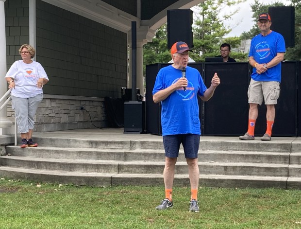 Rock the Ride founder U.S. Rep. Mike Thompson, D-California, speaks during the second-annual North Shore Rock the Ride as U.S. Rep. Brad Schneider, D-Highland Park, and local event organizer Pam Faulkner look on. (Steve Sadin/For the Lake County News-Sun)