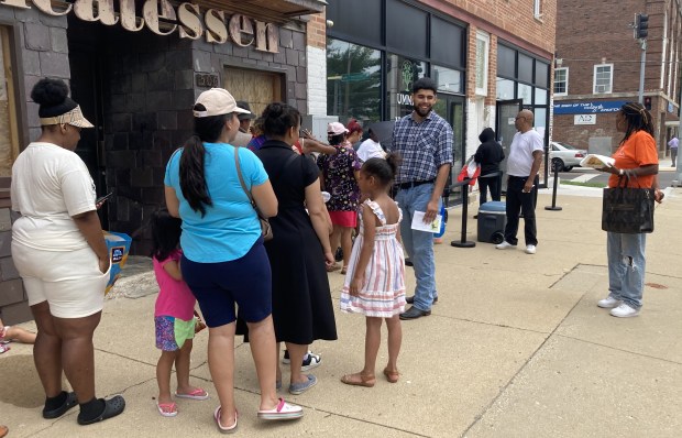 People stand in line to shop at the UMMA Harvest Market in Waukegan. (Steve Sadin/For the Lake County News-Sun)