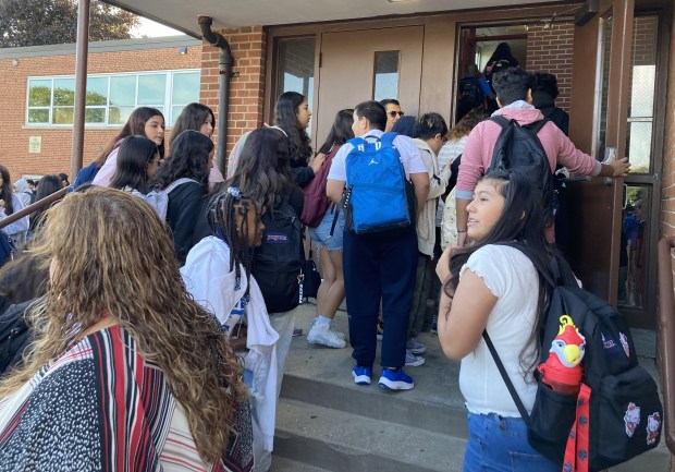 Students enter Edith Smith Middle School on the first day of class. (Steve Sadin/For the Lake County News-Sun)