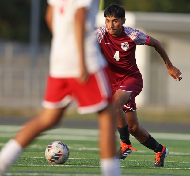 Elgin's Roberto Salinas (4) moves the ball through traffic against Dundee-Crown during a nonconference match on Monday, Sept. 16, 2024 in Elgin. (H. Rick Bamman / The Beacon News)