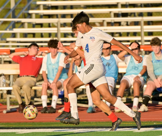 Marmion's Emilio Arizaga (4) works for control of the against Maine South during the St. Charles East Invitational in St. Charles on Wednesday, Sept. 4, 2024. (Mark Black / The Beacon-News)