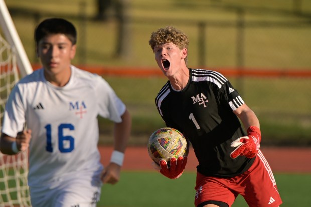 Marmion's Adam Ozsvath (1) catches a shot on goal by Maine South during the St. Charles East Invitational in St. Charles on Wednesday, Sept. 4, 2024. (Mark Black / The Beacon-News)