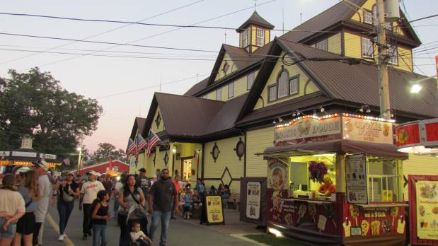 Visitors enjoy an evening at the Sandwich Fair, which ran from Wednesday through Sunday. (Linda Girardi / For The Beacon-News)