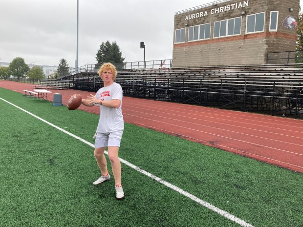 Aurora Christian quarterback Asa Johnson throws the ball before practice at Aurora Christian on Tuesday, Sept. 24, 2024. (Rick Armstrong / The Beacon-News)