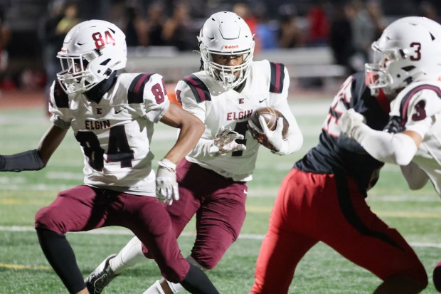 Elgin's Jeremiah Hill (4) scores a touchdown off a screen pass against East Aurora during an Upstate Eight conference game in Aurora on Friday, Sept. 27, 2024. (Troy Stolt / The Beacon-News)