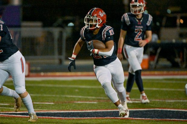 West Aurora's Michael Williams (21) runs the ball against Elgin in Aurora on Friday, Sept. 13, 2024. (Mark Black / The Beacon-News)