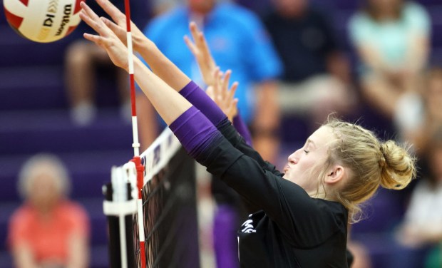 Hampshire's Elizabeth King (1) blocks a hit by Burlington Central during a Fox Valley Conference game on Thursday, Sept. 19, 2024 in Hampshire. (H. Rick Bamman / The Beacon News)