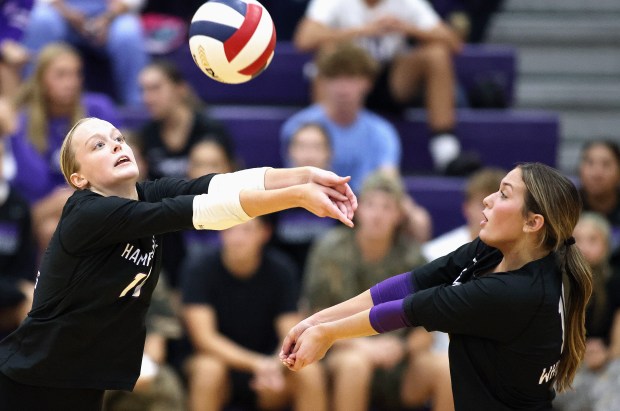 Hampshire's Jorah Rutter (11) returns as Katelynn Petterson (19) covers during a Fox Valley Conference game against Burlington Central on Thursday, Sept. 19, 2024 in Hampshire. (H. Rick Bamman / The Beacon News)