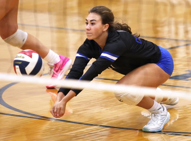 Burlington Central's Brianna Gritzman (11) defends with a dig during a Fox Valley conference game against Cary-Grove Thursday, Sept. 26, 2024 in Cary.H. Rick Bamman / The Beacon-News