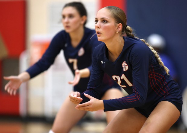 South Elgin's Brianna Decheva (7) and Cassie Verley (21) anticipate a serve during an non-conference match against Lake Park in South Elgin on Thursday, Sept. 5, 2024. (H. Rick Bamman / The Beacon-News)