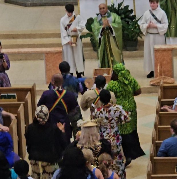 The Rev. Godwin Nsikan-Ubom Asquo, founder of ImaBridge Africa and pastor of St. Joseph Catholic Church in Aurora, celebrates mass with hundreds of parishioners and guests who that same day took part in the city's "First Taste of Africa Cultural Event