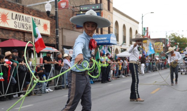 A performer does rope tricks during the Mexican Independence Day Parade in Little Village on Sept. 16, 2023. (Trent Sprague/Chicago Tribune)