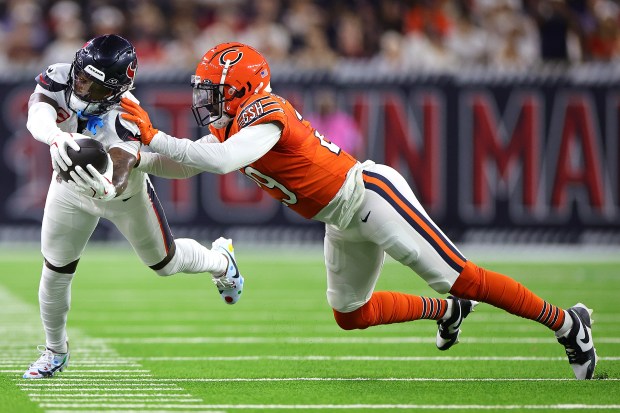 Texans' Stefon Diggs dives with the ball against the Bears' Tyrique Stevenson during the second quarter at NRG Stadium on Sept. 15, 2024 in Houston. (Photo by Alex Slitz/Getty Images)