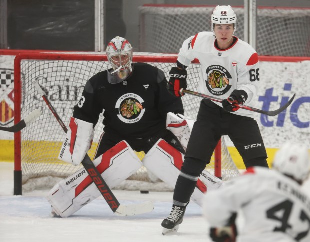 Blackhawks right wing Martin Misiak (68) and goaltender Drew Commesso (33) practice on Sept. 11, 2024, at Fifth Third Arena. (Brian Cassella/Chicago Tribune)