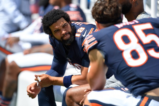 Bears quarterback Caleb Williams talks with tight end Cole Kmet during the first half of a preseason game against the Bills on Aug. 10, 2024, in Orchard Park, N.Y. (Adrian Kraus/AP)